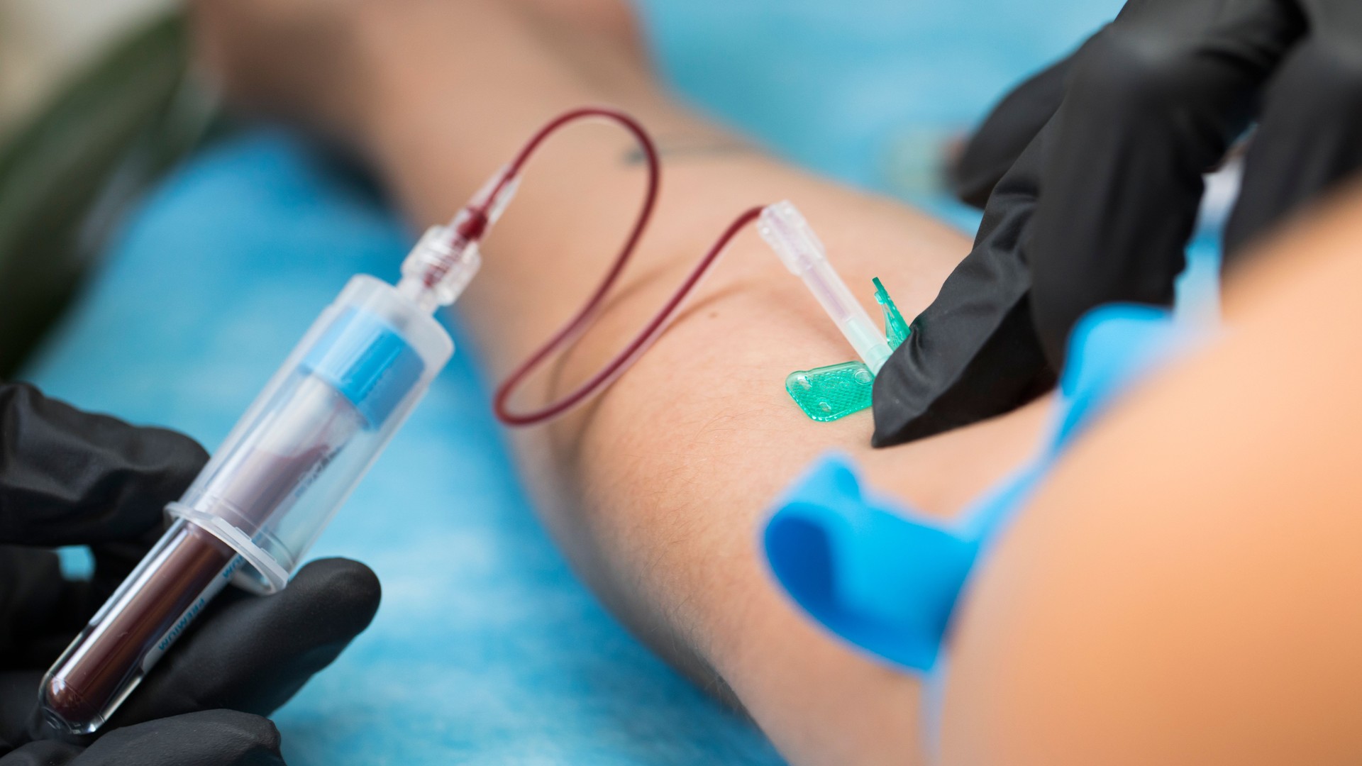 Nurse taking blood samples in hospital